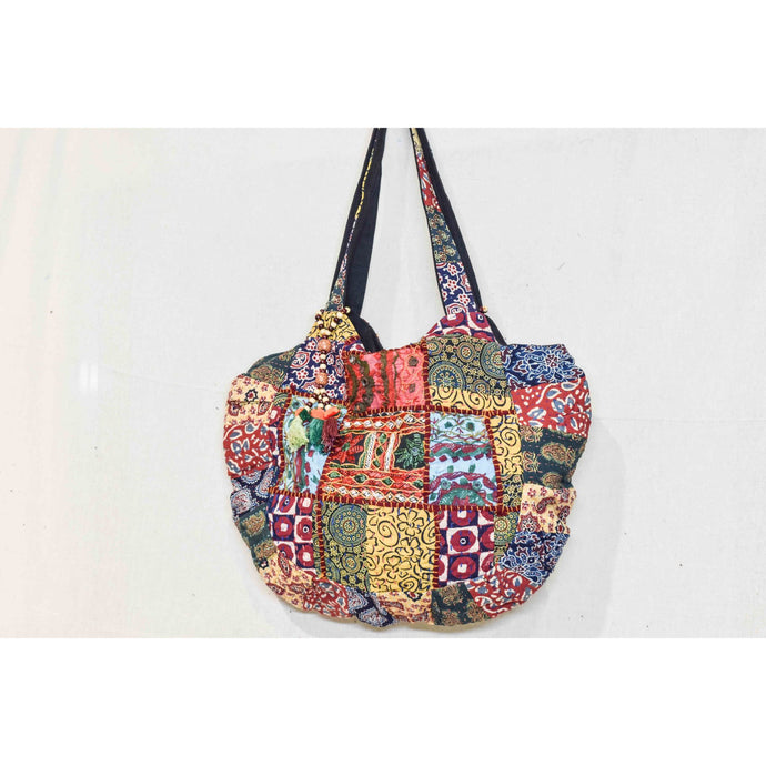 Antique patchwork shoulder bag. With a gusset. 35cm (not including handle), tassels on the straps. Lined. Zip fastening. Internal pocket. £30. From India.
